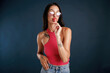 © standret - Red lollipop is in the hand. Beautiful young woman is against background
