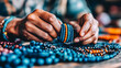 © EvgeniiaFreeman - Artisan Creating Handcrafted Beaded Jewelry in Workshop