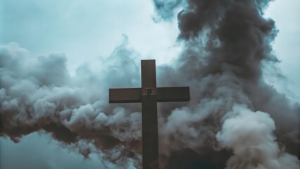 Wall Mural - A Wooden Cross Against a Background of Smoke and Clouds