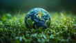 © Alex Alex - Earth globe on green grass with bokeh background, save earth concept