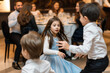 © Sascha - A girl in a blue dress is playing with two boys