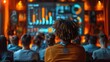 © andriyyavor - Back view of an audience attentively watching a data presentation on a screen displaying colorful charts in a modern, vibrant conference setting.