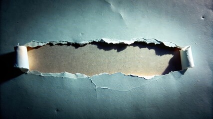 Wall Mural - A Torn Hole in Blue Paper Revealing Brown Underneath