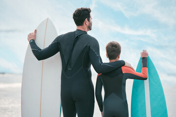 Sticker - Surfboard, dad and child on beach for back view, sports or exercise on outdoor bonding adventure. Surfer, father and son at ocean for surfing, teaching and learning together with support and growth