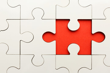 Sticker - White puzzle with missing piece on red background, top view