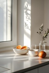 Wall Mural - A serene kitchen scene with fruit and glass containers, illuminated by soft sunlight.