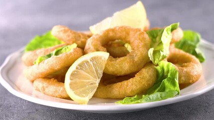 Wall Mural - Crispy Fried Calamari with Lemon on a Plate