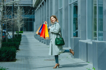 Woman with colorful shopping bags, shopaholic theme, spending money on clothes