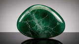 Polished jade stone with plain background