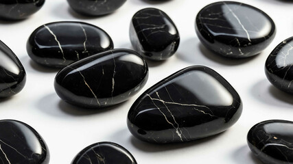 Smooth obsidian stone with plain white background