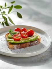 Wall Mural - A slice of toast topped with avocado, cherry tomatoes, and herbs on a white plate.