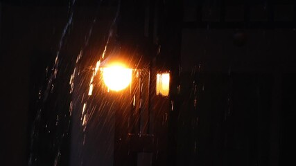 Canvas Print - Lamps on the fence on a rainy night Severe thunderstorm