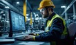 © Onchira - man with yellow helmet work on computer inside the heavy industry factory, male industrial engineer works on personal computer typing and check equipment