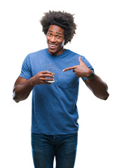 Wall Mural - afro american man drinking glass of water over isolated background very happy pointing with hand and