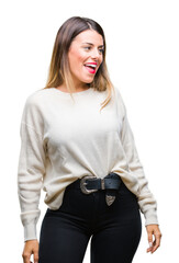 Wall Mural - Young beautiful woman casual white sweater over isolated background looking away to side with smile on face, natural expression. Laughing confident.