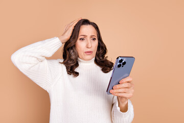 Wall Mural - Photo of stressed depressed senior woman wear white stylish clothes touch head isolated on beige color background