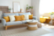 © Pixel-Shot - Interior of modern light living room with sofa and table, blurred view