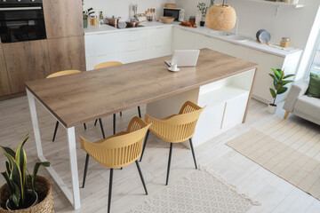 Poster - Wooden table and chairs in interior of modern dining room