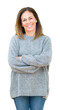 © Krakenimages.com - Beautiful middle age woman wearing winter sweater over isolated background happy face smiling with crossed arms looking at the camera. Positive person.