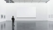 © Yuwarin - A large blank white vertical rectangle is hanging on the wall of an art gallery, with man standing next to it and looking at it