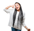 © Krakenimages.com - Young braided hair african american girl wearing sweater over isolated background smiling doing phone gesture with hand and fingers like talking on the telephone. Communicating concepts.