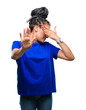 © Krakenimages.com - Young braided hair african american girl wearing glasses over isolated background covering eyes with hands and doing stop gesture with sad and fear expression. Embarrassed and negative concept.