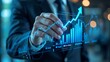 © Din Nasahrudin - Business growth concept with hand touching rising digital graph on futuristic interface.