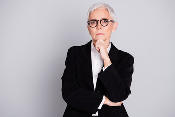 Poster - Photo portrait of attractive mature woman professional ceo thoughtful touch chin dressed formalwear specs isolated on gray color background