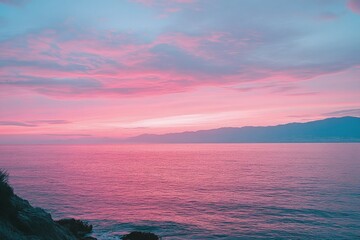 Wall Mural - a pink and blue sunset over a body of water