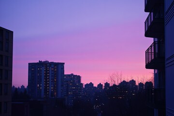 Sticker - a view of a city at dusk from a high rise building