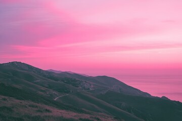 Canvas Print - a pink sky over a mountain with a road going through it