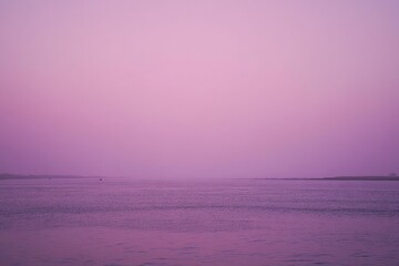 Wall Mural - a large body of water sitting under a purple sky