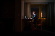 © Alexander - Riga, Latvia  A man works at a desk late at night illuminted by a computer.