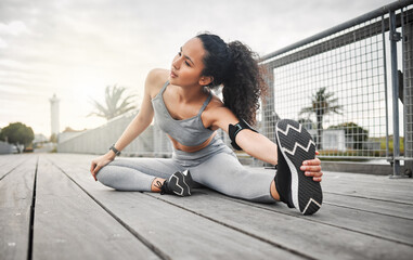 Canvas Print - Woman, legs and stretching outdoor for exercise, running and cardio fitness in morning with flexible. Athlete, muscle and warm up on bridge for health, training and workout with physical activity