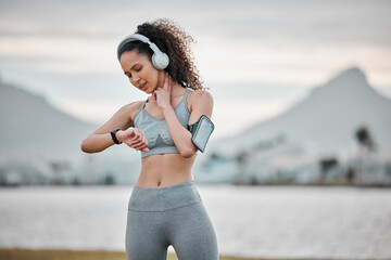 Canvas Print - Time, pulse and woman in nature for exercise, marathon training and workout listening to music, audio and podcast. Sports, fitness and person track heartbeat for wellness, health and running outdoors