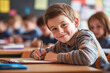 © Taras Roshchuk - Smiling young boy happily writing at his desk in a bright, colorful classroom during a lesson.