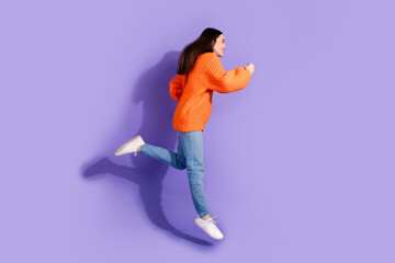 Poster - Photo of cheerful positive girl wear trendy clothes footwear run fast isolated on violet color background