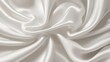 © Zemiu - Elegant waves of golden silk and white fabric in smooth, flowing curves, capturing the luxury and softness of satin texture