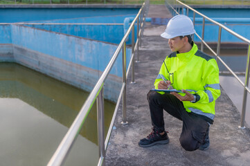 Environmental engineers work at wastewater treatment plants,Water supply engineering working at Water recycling plant for reuse