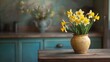 © BerkahStock - A vase of yellow daffodils on a wooden table in a cozy, rustic kitchen setting.