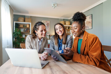 Wall Mural - Diverse Female Entrepreneurs Conducting Business in Home Office