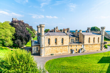 Wall Mural - A view down the side of  Lincoln Castle past the Lincoln Crown Court in Lincoln, Lincolnshire in summertime