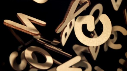 Wall Mural - The fall of wooden English letters. Filmed on a high-speed camera at 1000 fps. High quality FullHD footage