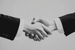 © Avr Di - A handshake between two businessmen indicating an agreement or contract.