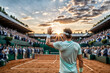 © Gaston - Tennis player gratefully saluting the crowd in a stadium at sunset celebrating victory. Tennis player waving to the audience while retiring from the sport