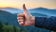 © Matthias - Thumbs Up with Blurred Nature Scene