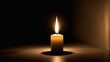 © darion - A lit candle casting a warm glow in a dark setting, symbolizing peace and reflection.