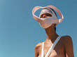 © Sandra Chia - Fashion Surreal Concept. Tanned slim woman in avant garde ethereal architectural futuristic swirl edgy art sculpture headgear mask in sky background. sensual, advertisement, magazine. copy space