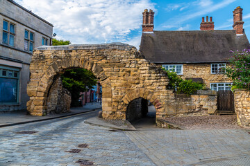 Wall Mural - A view towards the old Roman Newport Arch entrance gate into Lincoln, Lincolnshire in summertime