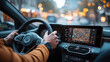 © kvladimirv - Person Driving with GPS Navigation in Modern Car on City Street with Evening Lights